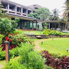 We used a variety of flowering plants and shrubs to add color and texture, creating a vibrant garden that contrasts beautifully with the green lawn and surrounding trees.