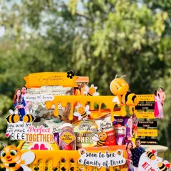 This "Soon to Bee a Family of Three" hamper is a sweet and punny gift for an anniversary or baby announcement. The honeybee theme is carried throughout, with cute decorations and a basket full of treats.