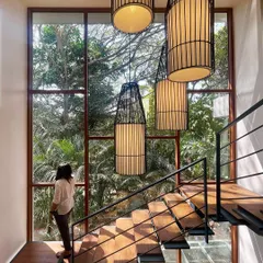 We believe staircases can be more than just functional. In our "Home by the Park" renovation, we designed this floating staircase to feel like an ascent through the tree canopy, creating a moment of connection with nature.