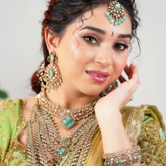 A close-up showcasing the magic of soft glam. The focus is on luminous skin, gently defined eyes, and a glossy lip, creating a fresh and contemporary bridal style.