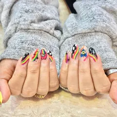 When you can't decide on one vibe, why not have them all? This set features a mix of hand-painted designs, including rainbows, checkerboard patterns, an evil eye, and watermelon slices for a truly unique look.