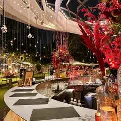 Our circular bar, dramatically decorated in scarlet red for a cocktail reception. It’s the perfect spot to grab a custom drink and soak in the party atmosphere.