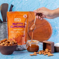This action shot for Open Secret's Caramel Sea Salt almonds makes the product interactive and delicious. The dripping caramel from the spoon creates a sense of indulgence that is hard to resist.