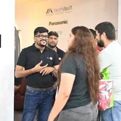 Our director, Divyang, in his element, engaging in a vibrant conversation with visitors at our exhibition booth. We thrive on these interactions, sharing our passion for technology and understanding our clients' needs.