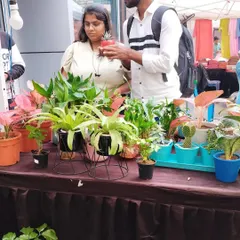 I enjoy talking to fellow plant lovers and helping them find the right plant. Here I am at the Embassy Tech Village bazaar, discussing a small succulent with a customer.