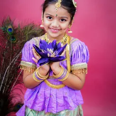Celebrating our beautiful traditions is something I am very passionate about. This is from a 'Mogina Jade' themed shoot, capturing the grace and innocence of childhood. The vibrant colors, traditional attire, and the child's bright smile make this a truly timeless portrait.