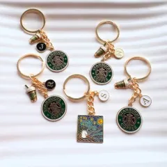 Add a personalised touch to your keys or bags with our custom keychains. This collection features Starbucks-themed charms and initial discs.