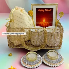 A closer look at the 'Golden Glow' hamper, highlighting the intricate gold wire basket and the arrangement of the festive items inside.
