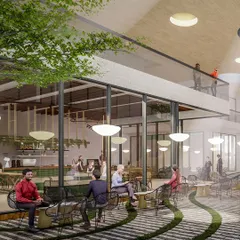 An interior view of the Myhome Vipina clubhouse cafe, which opens directly onto the landscaped courtyard. The seamless connection between inside and outside is a key part of our design philosophy for creating breathable, open community spaces.