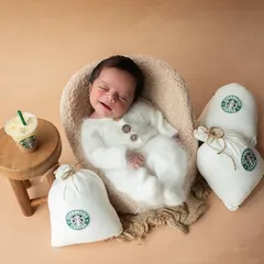 When mom and dad own a coffee plantation, a Starbucks theme is a must! This little one is smiling in his sleep, dreaming of his first puppuccino.