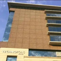 A detailed look at the facade of the Technopolis IT Hub. The grid-like pattern of the cladding provides a sense of order and scale to the structure.