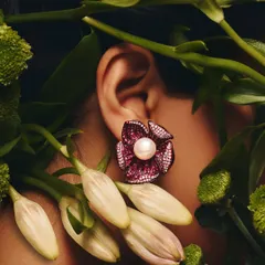 And like a flower, you bloom. Our Ruby Floret earrings, featuring a central pearl and diamond-dusted petals, are the perfect statement makers for any occasion.