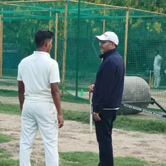 One-on-one interactions are a key part of our mentorship. Here, a trainee receives personalized feedback from Virender Sehwag, a unique opportunity for aspiring players.