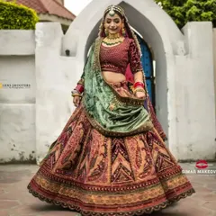 This unique multi-colored velvet lehenga with a contrasting mint green dupatta is perfect for a winter wedding. I love helping brides find outfits that truly reflect their personality.
