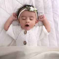 Caught in a sleepy yawn, this is the definition of newborn bliss. I capture these candid, fleeting moments during my sessions, preserving the authentic sweetness of your baby's first few weeks.