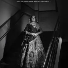 For me, bridal photography is a form of fashion portraiture. This black and white shot of a bride on a staircase uses shadow and light to create a timeless, cinematic feel. I focus on capturing the grandeur of the wedding lehenga and the quiet elegance of the moment before the ceremony.