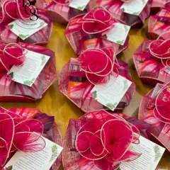 These wedding in-room hampers are designed to be a warm welcome for your guests. Wrapped in vibrant pink fabric, they are filled with thoughtful items to make their stay comfortable and memorable.