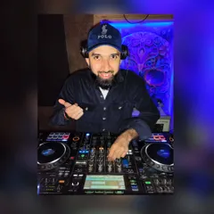 A closer look at me working the mixer. Every knob and fader is used to shape the sound and create a seamless flow of music.