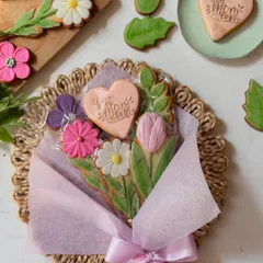 A beautiful cookie bouquet for Mother's Day, with hand-decorated floral and heart-shaped cookies arranged like a bunch of flowers. This is a unique and lasting way to say "I love you".