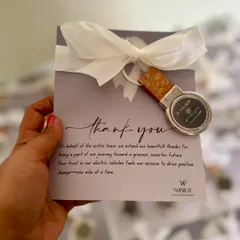 A simple "thank you" can be powerful. We designed these elegant cards with a custom keychain for an electric vehicle brand to express gratitude to their clients.