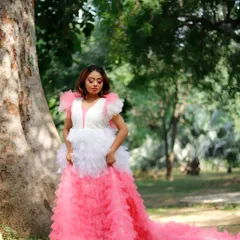 A full-length photo showing the complete editorial look. The makeup, hair, and dramatic dress come together to create a stunning, high-fashion image in a natural outdoor setting.