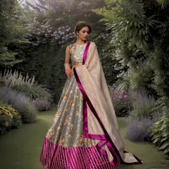 Draped in the timeless allure of Printed Banaras georgette silk and accented delicately with velvet, this lehenga unfolds a story of eternal grace and enduring charm for any special occasion.