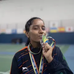 **World Champion in the Making.** A moment of pure joy as our para-athlete Aaditya Yadav kisses her medal after her incredible performance at the World Deaf Badminton Championship in Brazil. We are immensely proud of our para-badminton program.