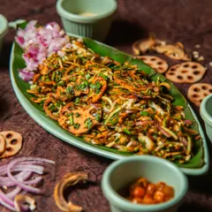 The Singju salad is a signature dish from Manipur and the inspiration for our name. It features a refreshing and crunchy mix of shredded vegetables, crispy lotus stem, and a distinctive dressing made with perilla seeds and fermented fish for an umami kick.
