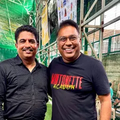 Our founder with an official at a turf facility, discussing potential collaborations. We are always looking for new spaces and partners to expand our volleyball programs.