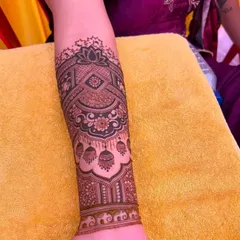 A beautiful armband design featuring jhumka (earring) motifs and a central lotus.