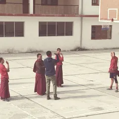 A moment of instruction and demonstration during our session at the monastery. The focus and discipline they brought from their daily lives translated beautifully to the basketball court.