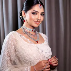 Embracing timeless elegance with a touch of glam. This beautiful makeup look with a soft smokey eye pairs perfectly with the grace of a white lehenga for a truly magical result.