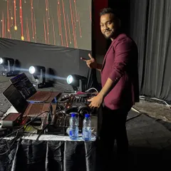 My talented DJ, Samm, at the console, getting ready to drop the beats that drive our entire show.