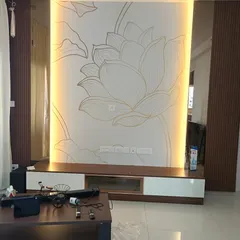 This TV unit wall combines dark fluted panels on the sides with a custom lotus line-art wallpaper in the center. I also integrated vertical backlighting to highlight the wallpaper and add a dramatic effect.