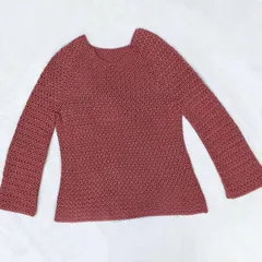 A full view of the finished Etoile Sweater, laid out to show its shape and the bell-sleeve design. Every crochet top is made to order, so we can adjust the length of the body and sleeves to your preference.