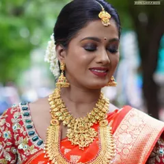 A close up of the eye makeup for a South Indian bride. I used warm, earthy tones with a touch of gold shimmer to make her eyes stand out, paired with a classic red lip.