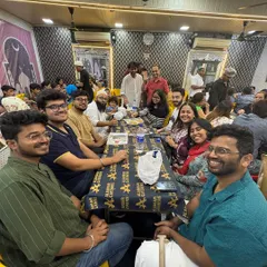 A full table of smiling guests. It's a joy to host large groups of friends and families.