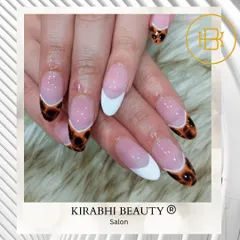 Who says French tips have to be simple? Here, I combined a classic white tip with a bold leopard print design for a wild and stylish look.