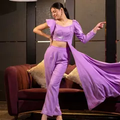 This shot captures the dramatic flair of a lavender co-ord set with a long, flowing side panel. The movement adds life to the studio shot, perfect for showcasing unique design features.