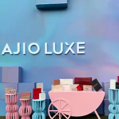 A full view of our pastel-themed activation for Ajio Luxe. We used a soft, gradient color palette and custom-built props like the pink cart and shapely side tables to create a playful yet sophisticated product display area.