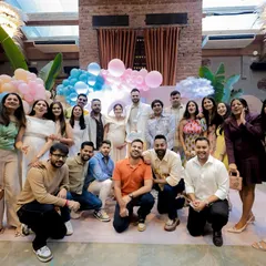 A wonderful group photo with friends and family. The joy and support surrounding the happy couple are palpable in this picture.