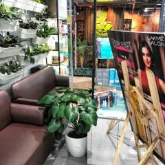 A plant installation at a Lakmé Salon. We used a large Homalomena plant and a vertical wall planter to create a refreshing and calming atmosphere in the waiting area, enhancing the client's relaxation experience.