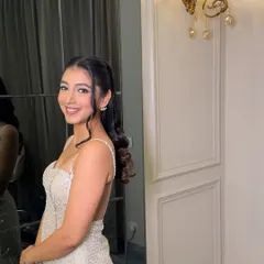 A side profile of Bhavya's party look. The makeup is designed to be beautiful from all angles, with a focus on glowing skin.