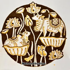 The final filled-in version of the cow and lotus art piece. The contrast is stunning.