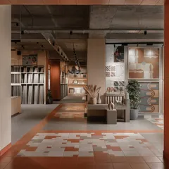 The entrance to the Trove experience center, a commercial space we designed from the ground up. We used warm terracotta tiles and carefully framed views to create a welcoming threshold, inviting visitors into a world of texture and pattern.