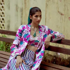 A closer look at the styling for this festive lookbook, featuring a mix of bold prints and statement jewelry.