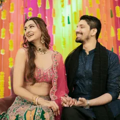 A shared laugh during the Mehndi ceremony. These are the candid, in-between moments that truly define your story.
