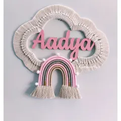 I absolutely love making these personalized macrame cloud and rainbow wall hangings. This piece for little Aadya was made with soft pinks and earthy tones, creating a dreamy and unique decoration for her nursery. I can customize the name, colors, and size to make it perfect for your child's room.