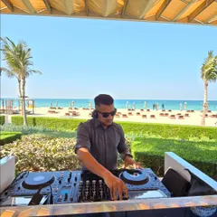 Setting the vibe for a beachside sundowner in Dubai. My work takes me to the most beautiful locations, and I specialize in creating the perfect soundtrack for any destination event, whether it's a relaxed brunch or a high-energy party.