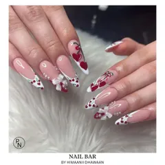 A super cute and detailed set with cherry patterns, 3D bows, and heart-shaped French tips. This shows our skill in creating playful, intricate designs.